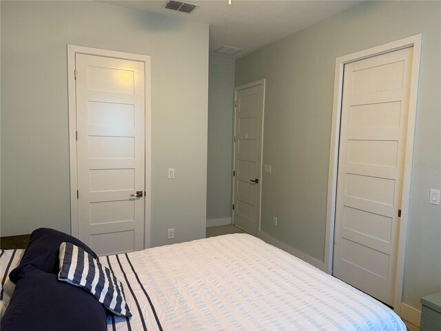 bedroom featuring baseboards