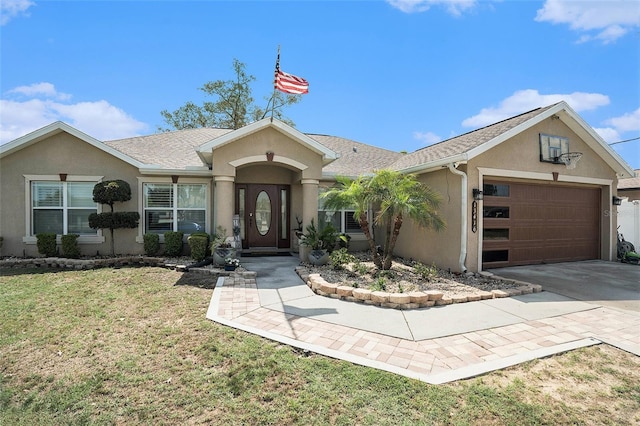 13416 Algoma Ave, Spring Hill, FL 34609 - ranch-style home featuring stucco siding, an attached garage, driveway, a front lawn, and a shingled roof