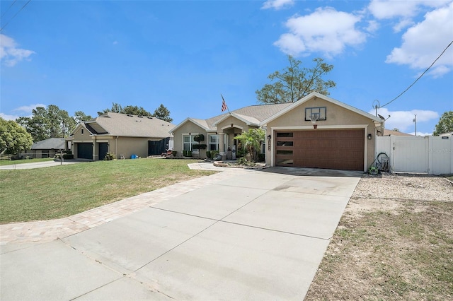 13416 Algoma Ave, Spring Hill, FL 34609 - ranch-style home with a garage, concrete driveway, stucco siding, and a gate