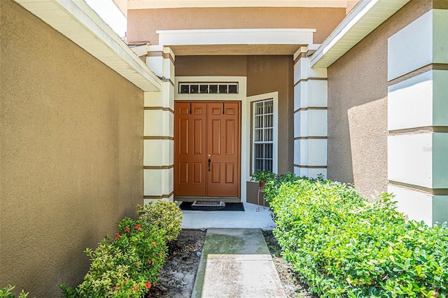 6130 Whimbrelwood Dr, Lithia, FL 33547 - entrance to property with stucco siding