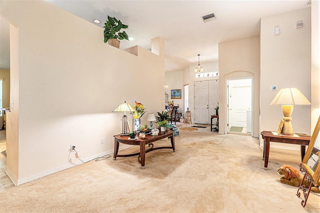 6130 Whimbrelwood Dr, Lithia, FL 33547 - entryway with light carpet, a towering ceiling, and arched walkways
