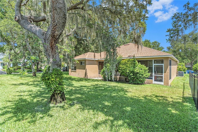 6130 Whimbrelwood Dr, Lithia, FL 33547 - view of green lawn featuring a sunroom