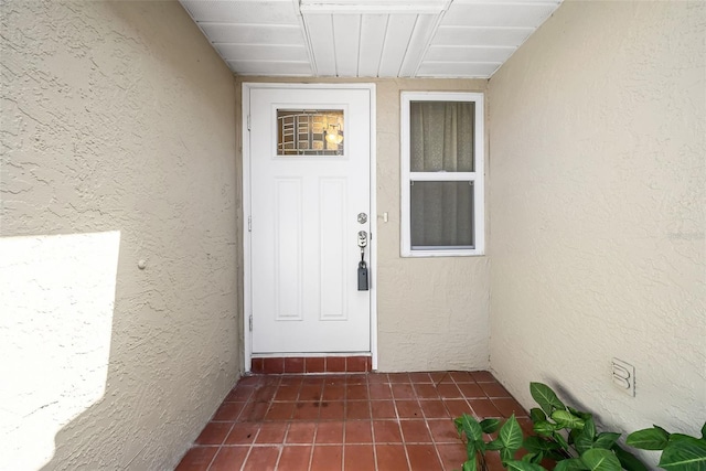1969 Wolf Laurel Dr, Sun City Center, FL 33573 - view of exterior entry with stucco siding