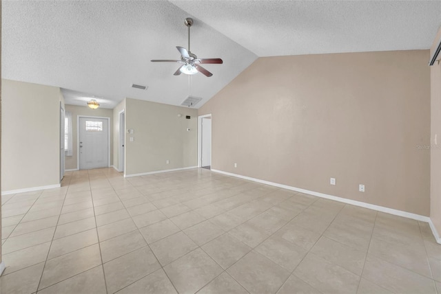 1969 Wolf Laurel Dr, Sun City Center, FL 33573 - unfurnished living room with baseboards, a textured ceiling, a ceiling fan, and lofted ceiling