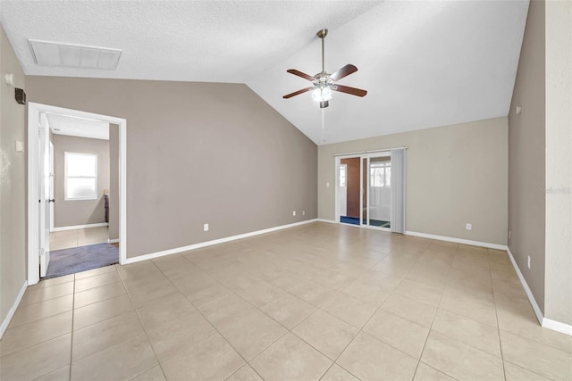 1969 Wolf Laurel Dr, Sun City Center, FL 33573 - unfurnished room with visible vents, a ceiling fan, a textured ceiling, light tile patterned flooring, and lofted ceiling
