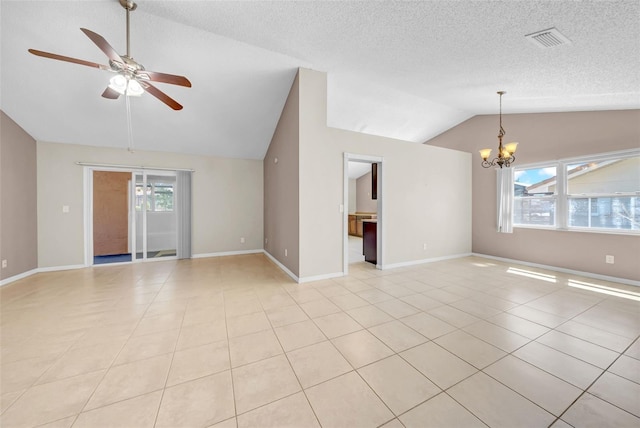 1969 Wolf Laurel Dr, Sun City Center, FL 33573 - unfurnished living room featuring ceiling fan with notable chandelier, light tile patterned flooring, lofted ceiling, and visible vents
