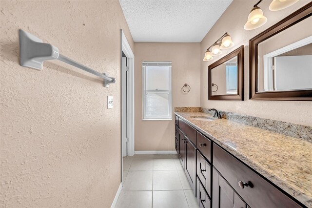 1969 Wolf Laurel Dr, Sun City Center, FL 33573 - bathroom featuring a textured ceiling, a textured wall, tile patterned flooring, and vanity