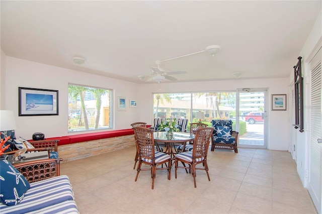 4725 Cove Cir Unit 810, Saint Petersburg, FL 33708 - dining area with a ceiling fan and light tile patterned floors