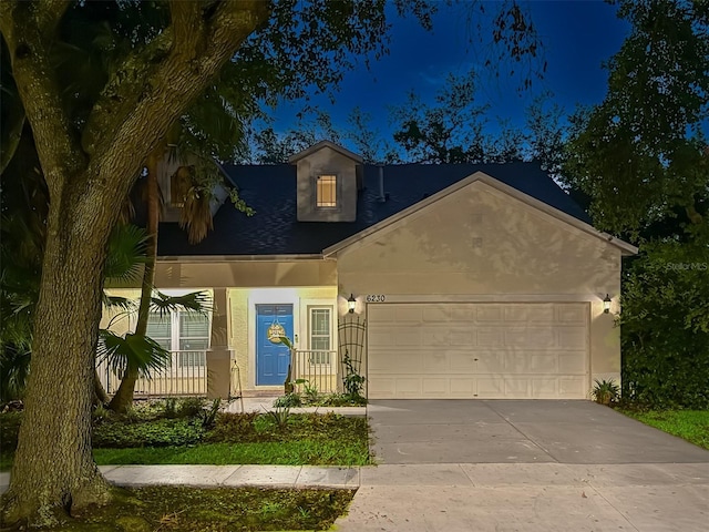6230 Gannetdale Dr, Lithia, FL 33547 - view of front facade featuring an attached garage, concrete driveway, and stucco siding