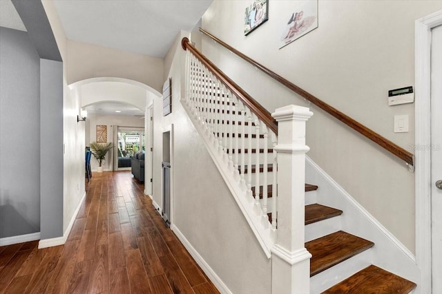 6230 Gannetdale Dr, Lithia, FL 33547 - stairway with arched walkways and wood finished floors