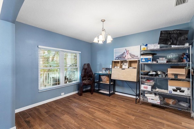 6230 Gannetdale Dr, Lithia, FL 33547 - bedroom featuring wood finished floors and a chandelier