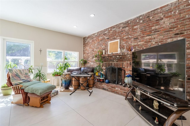3302 W Caracas St, Tampa, FL 33614 - living room with a fireplace, brick wall, recessed lighting, and concrete floors