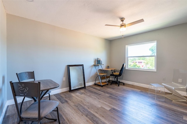 3302 W Caracas St, Tampa, FL 33614 - office area with wood finished floors, a ceiling fan, and baseboards