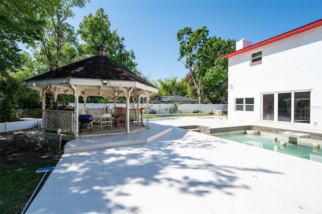 3302 W Caracas St, Tampa, FL 33614 - view of swimming pool featuring a gazebo, a fenced backyard, a jacuzzi, and a patio