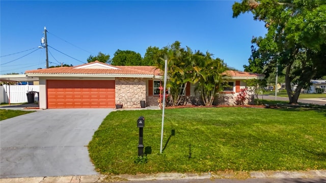 1469 S Hillcrest Ave, Clearwater, FL 33756 - ranch-style house with stone siding, a garage, driveway, a tile roof, and a carport