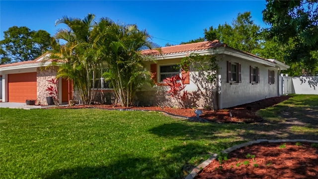 1469 S Hillcrest Ave, Clearwater, FL 33756 - view of front of home with a garage, stucco siding, stone siding, and a tiled roof