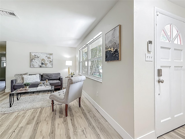 1469 S Hillcrest Ave, Clearwater, FL 33756 - living area with light wood-style floors and baseboards
