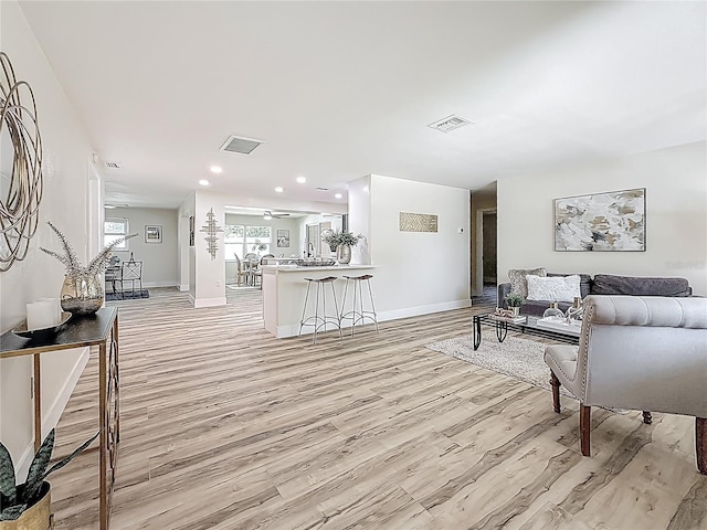 1469 S Hillcrest Ave, Clearwater, FL 33756 - living room with light wood-type flooring, baseboards, recessed lighting, and ceiling fan