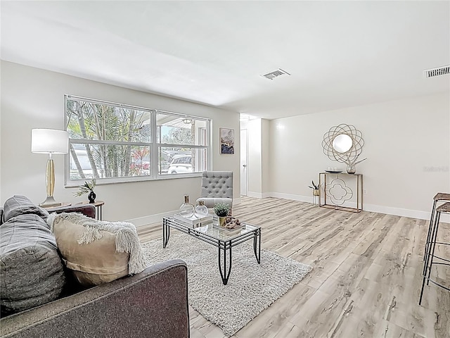 1469 S Hillcrest Ave, Clearwater, FL 33756 - living area with light wood finished floors and baseboards
