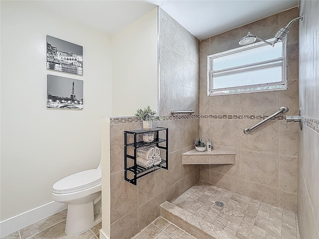 1469 S Hillcrest Ave, Clearwater, FL 33756 - bathroom featuring tiled shower, toilet, tile patterned flooring, and baseboards