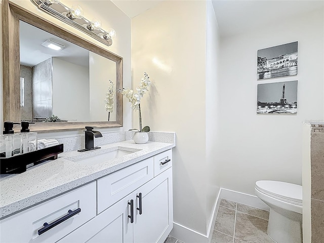1469 S Hillcrest Ave, Clearwater, FL 33756 - bathroom featuring vanity, toilet, baseboards, and tile patterned floors