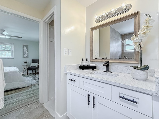 1469 S Hillcrest Ave, Clearwater, FL 33756 - full bathroom featuring vanity, plenty of natural light, connected bathroom, and baseboards