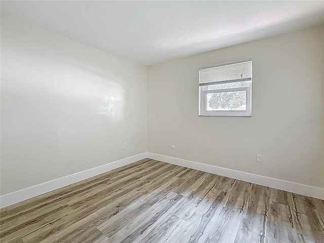 1469 S Hillcrest Ave, Clearwater, FL 33756 - spare room with baseboards and wood finished floors