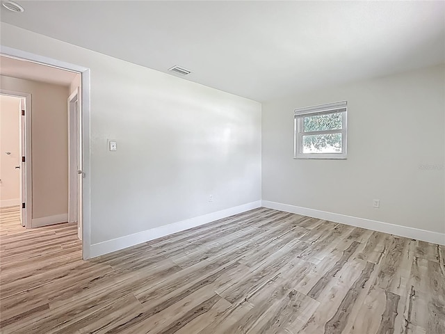 1469 S Hillcrest Ave, Clearwater, FL 33756 - empty room featuring light wood-style flooring and baseboards