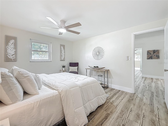 1469 S Hillcrest Ave, Clearwater, FL 33756 - bedroom featuring light wood-style floors, a ceiling fan, and baseboards
