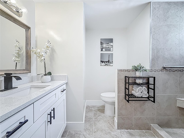 1469 S Hillcrest Ave, Clearwater, FL 33756 - full bathroom featuring vanity, toilet, and baseboards