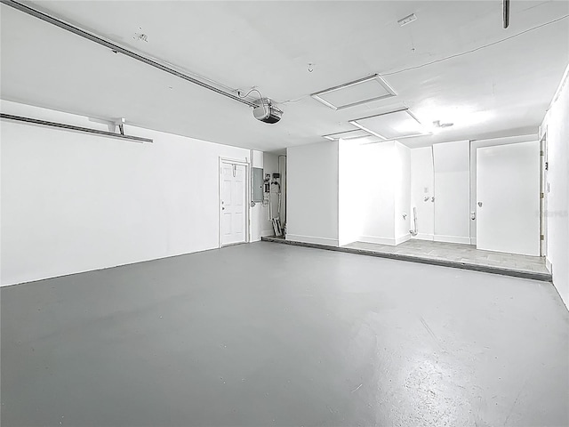 1469 S Hillcrest Ave, Clearwater, FL 33756 - garage with electric panel and a garage door opener