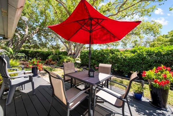 8244 Brentwood Rd, Seminole, FL 33777 - deck with outdoor dining space