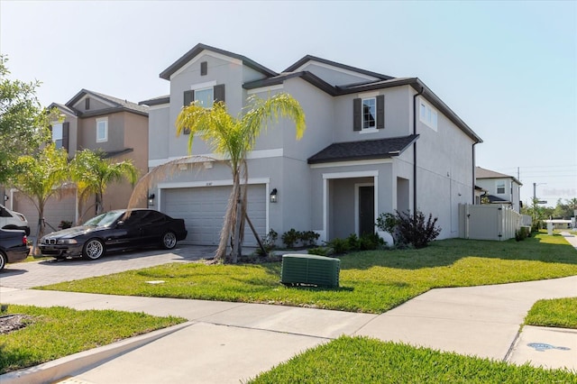 traditional home featuring driveway, stucco siding, fence, a garage, and central AC unit
