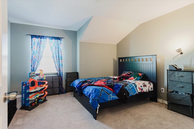 bedroom featuring carpet and vaulted ceiling