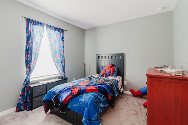 carpeted bedroom with baseboards