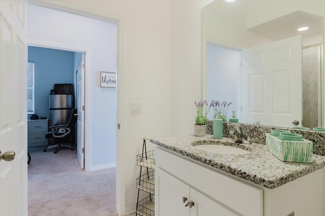 bathroom featuring vanity and baseboards
