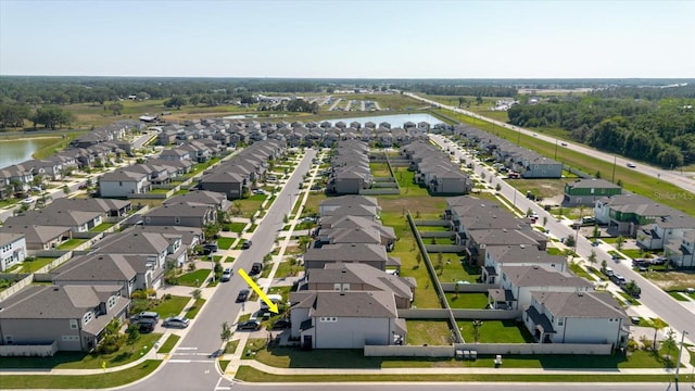 bird's eye view with a water view and a residential view