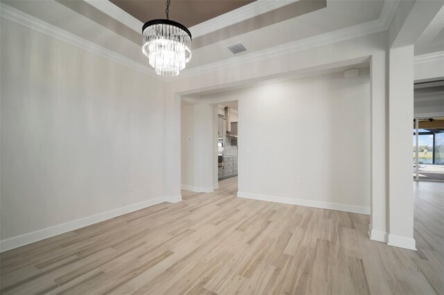 5325 San Remo Cir, Wimauma, FL 33598 - unfurnished dining area featuring a chandelier, light wood finished floors, visible vents, and baseboards