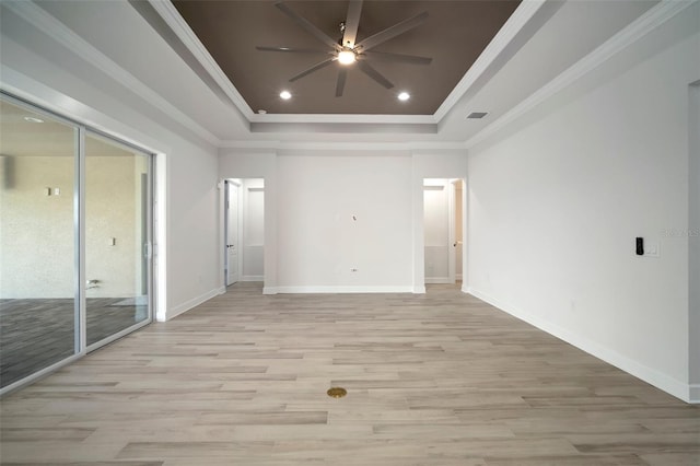 5325 San Remo Cir, Wimauma, FL 33598 - interior space with crown molding, a tray ceiling, a ceiling fan, and light wood-style floors