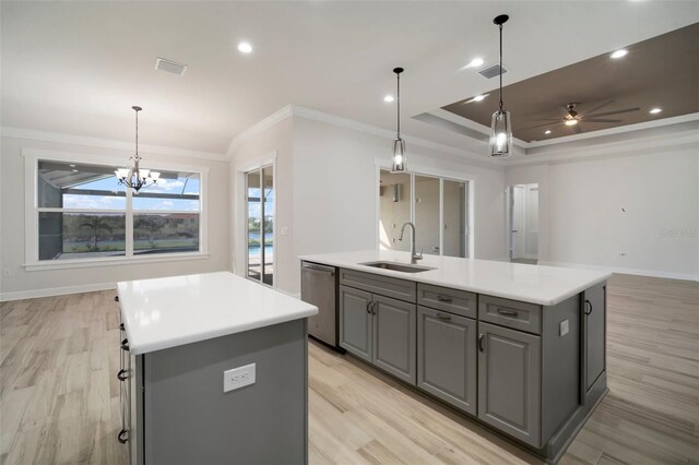 5325 San Remo Cir, Wimauma, FL 33598 - kitchen featuring a sink, an island with sink, crown molding, gray cabinetry, and stainless steel dishwasher