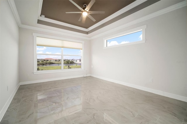 5325 San Remo Cir, Wimauma, FL 33598 - empty room with a tray ceiling, marble finish floor, ornamental molding, and plenty of natural light