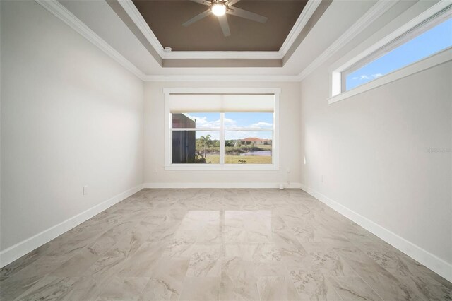5325 San Remo Cir, Wimauma, FL 33598 - empty room featuring baseboards, a ceiling fan, crown molding, a tray ceiling, and marble finish floor