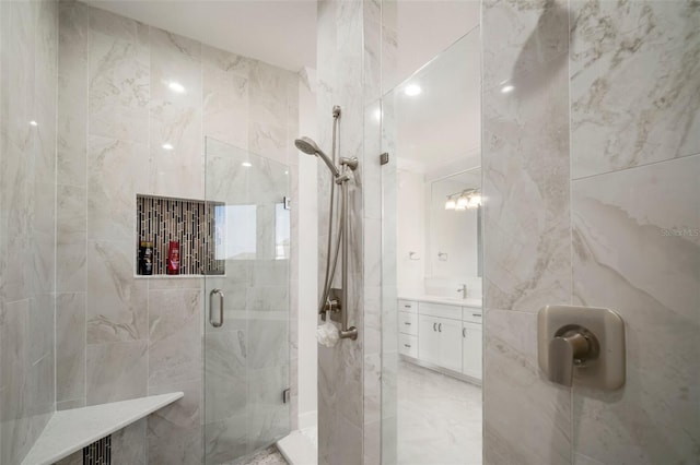 5325 San Remo Cir, Wimauma, FL 33598 - bathroom featuring a shower stall, vanity, and marble finish floor