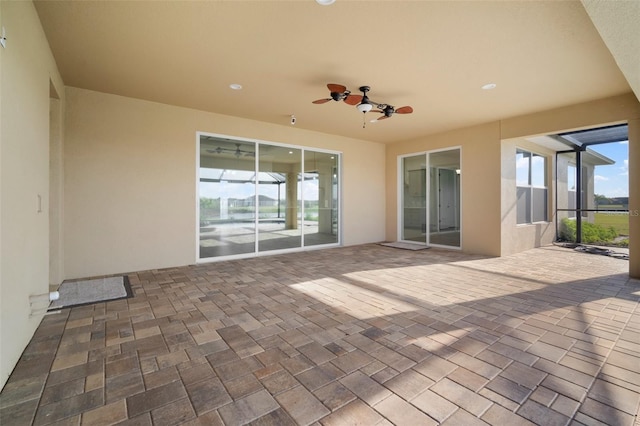5325 San Remo Cir, Wimauma, FL 33598 - view of patio featuring glass enclosure and a ceiling fan