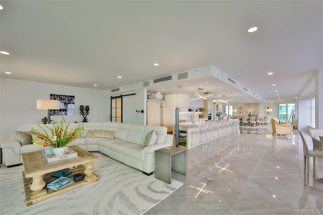 3435 Bayshore Blvd Unit 2100P, Tampa, FL 33629 - living area with a barn door, light tile patterned flooring, and recessed lighting