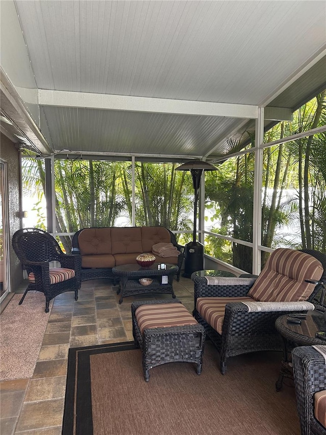 sunroom / solarium with outdoor lounge area and a healthy amount of sunlight