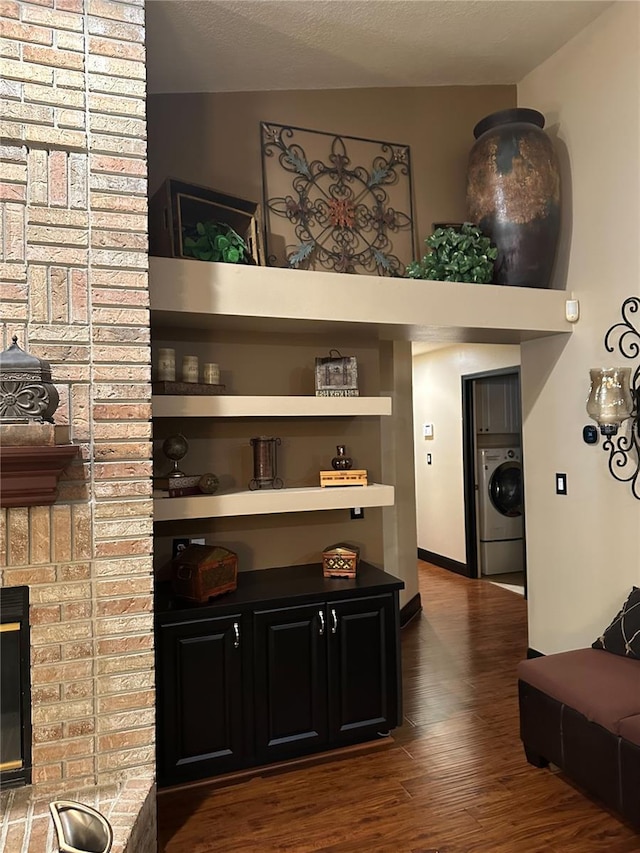 interior details with washer / clothes dryer and wood finished floors