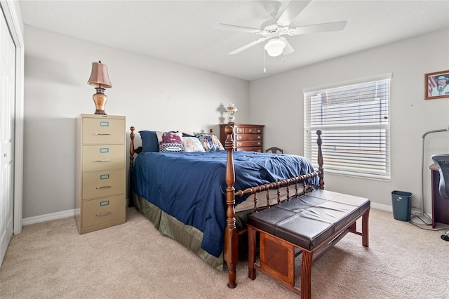 6745 Basswood Cir, Zephyrhills, FL 33542 - bedroom with light colored carpet, baseboards, and a ceiling fan