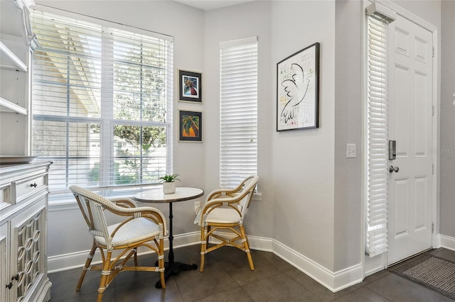 dining area featuring baseboards