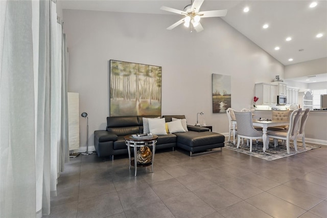 living room featuring high vaulted ceiling, recessed lighting, baseboards, and a ceiling fan